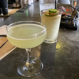 two cocktails on a bar