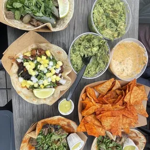 Carne Asada Taco Queso , Guacamole 16 oz, and house-made chips Pirata Taco