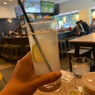 a person holding a drink