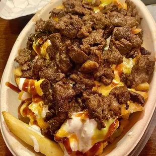 Fuego fries with steak