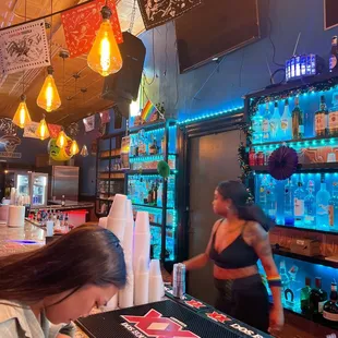 a woman working at a bar