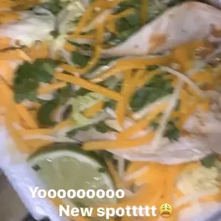 a person holding a tray of food