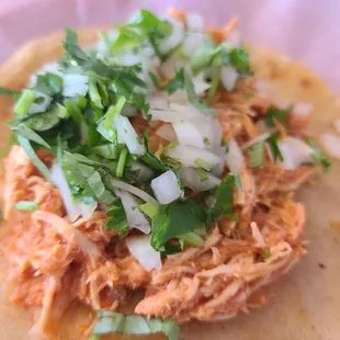 a chicken taco on a tortilla