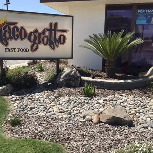 a sign in front of a restaurant