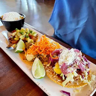 a plate of tacos and rice