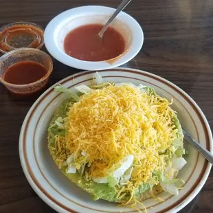 Guacamole tostada with picante &amp; hot sauce