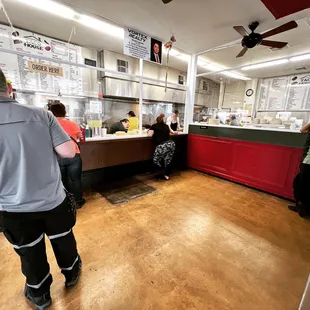 customers waiting in line at the counter