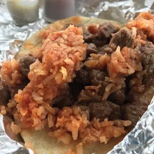 Carne guisada and Mexican rice taco