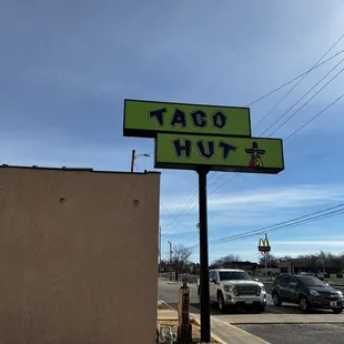 a taco hut sign in a parking lot