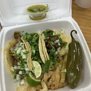 Three tacos: steak, lengua and barbacoa