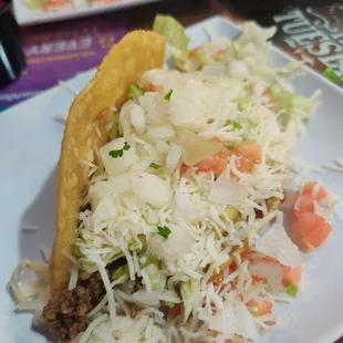 Crispy taco with added onions. So good and not greasy