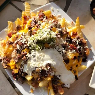 a plate of nachos on a table