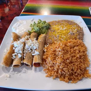 2 Beef Taquitos, 2 Chicken Taquitos, Rice, Beans, Guacamole, and Sour Cream