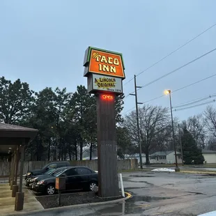 a car parked in front of a taco inn