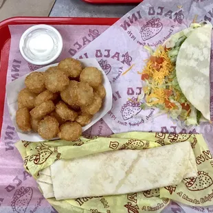 Potato things, cheesy burrito, and a soft taco