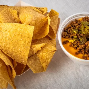 a bowl of chips and a bowl of salsa