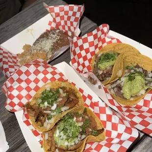 2 carne asada and 2 adobada tacos with beans and rice. Best tacos I've had on island so far