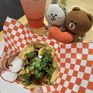 Adobada taco (marinated pork) and a watermelon agua fresca