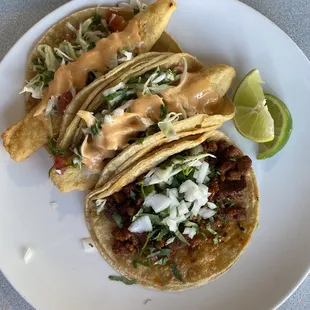 Two Taco de Pescado and one Taco de Carnitas