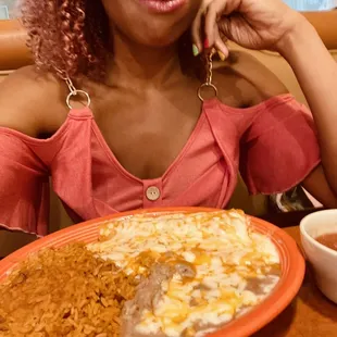 Indulging in some delicious enchiladas that melt in your mouth!