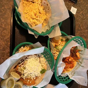 three baskets of food on a tray