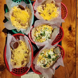 a variety of tacoss in baskets