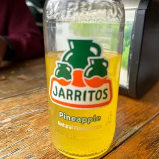 Jarritos Pineapple with Pastorito tacos