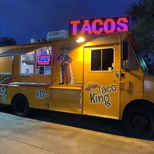 a taco truck parked in a parking lot