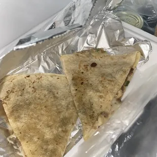 two quesadillas wrapped in foil