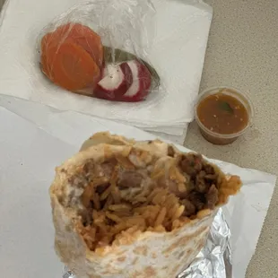a burrito with meat and vegetables