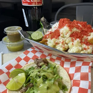 Tosti Elote dusted with hot Cheetos and a carne asada taco with an ice cold Mexican Coke