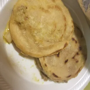 Green salsa meat and potatoes gorditas.