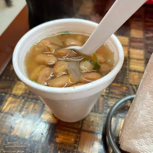 a bowl of soup with a spoon in it
