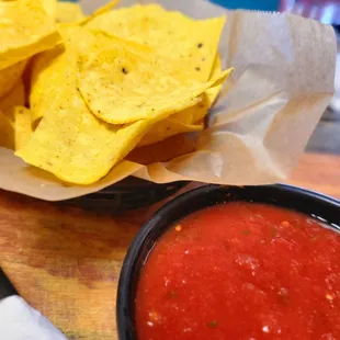 a bowl of salsa and chips