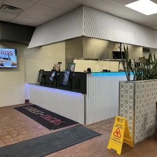 Front self serve ordering station. Options to take cash or credit card.