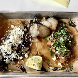 Mexican truffle taco on the left