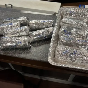 Assorted breakfast burritos for our staff breakfast.