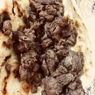 Homemade tortillas and tender melt-in-our-mouth beef