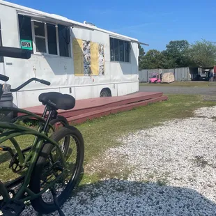 a bicycle parked in front of a trailer