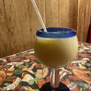 a drink in a glass with a straw