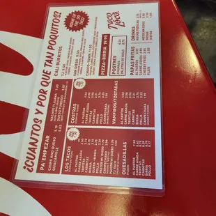 a menu on a red table