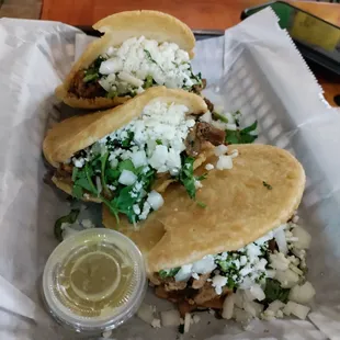 three tacos in a basket