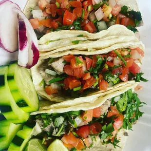 three tacos on a plate