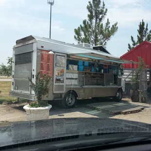 a taco truck parked in a parking lot