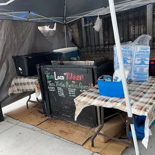 a table set up under an umbrella