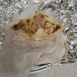 a wrapper with meat and lettuce