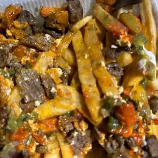 Asada fries , with undercooked raw fries