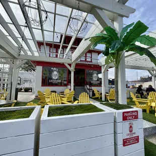 a patio with yellow chairs