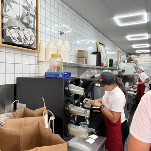 two people working in a restaurant kitchen