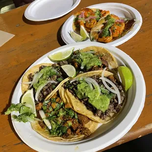 Al pastor and carne asada in front, shrimp tacos behind